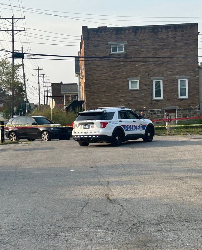 A Columbus police cruiser at the scene of a fatal motorcycle accident July 15, 2026, at the intersection of East Woodrow and Parsons avenues on Columbus' South Side. The black SUV in the center of the scene is believed to have collided with the motorcycle and had moderate damage to its front end.