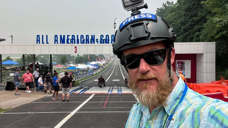 Akron Beacon Journal visual journalist Andrew Dolph uses a GoPro camera on his helmet to capture his experience going down the track July 16 at Derby Downs.