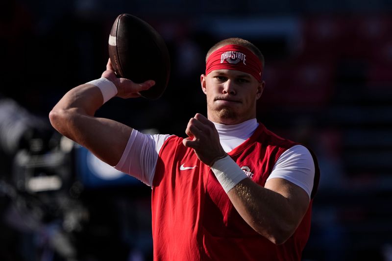 Ohio State Buckeyes quarterback Lincoln Kienholz (3) warms up prior to the NCAA football game against the Rutgers Scarlet Knights at Ohio Stadium in Columbus on Nov. 22, 2025.