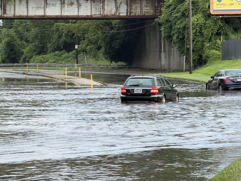 Vehicles submerged in water on Red Bank Expressway in Madisonville after afternoon storms hit the area July 17, 2026.
