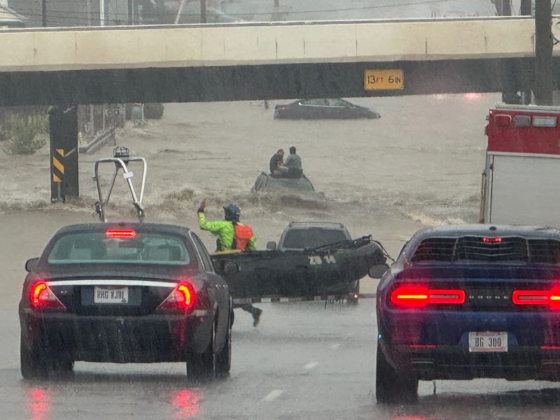 Floodwaters trapped a vehicle in the middle of Madison Road in Oakley during the July 17 storm.