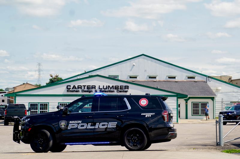 Police investigate the scene of a shooting at Carter Lumber in Mason, Ohio, on Wednesday, July 22. An employee has died following a shooting at a door manufacturing facility in Mason, the company said in a statement published on Facebook.