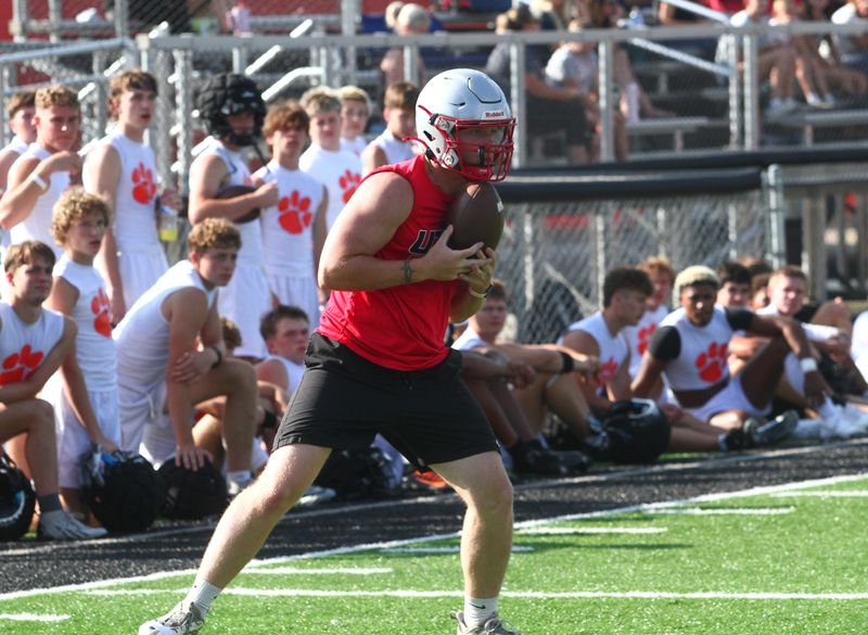 Utica's Elijah Bland catches a pass in the flat against Huntington during a 7-on-7 competition at New Lexington on July 22, 2026.