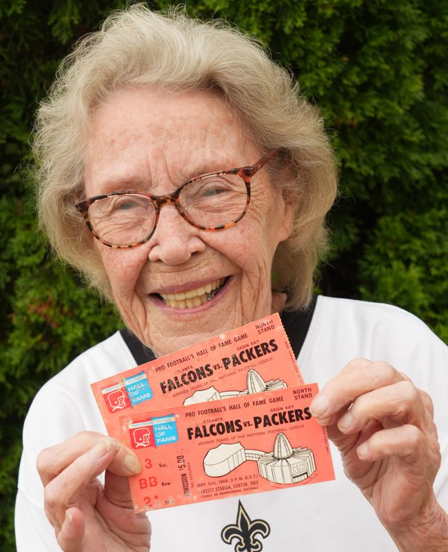Judy Villono of Plain Township poses with her Hall of Fame Game tickets from 1969, Friday, July 24, 2026. She has seen every Hall of Fame Game since then. Kevin Whitlock / Massillon Independent