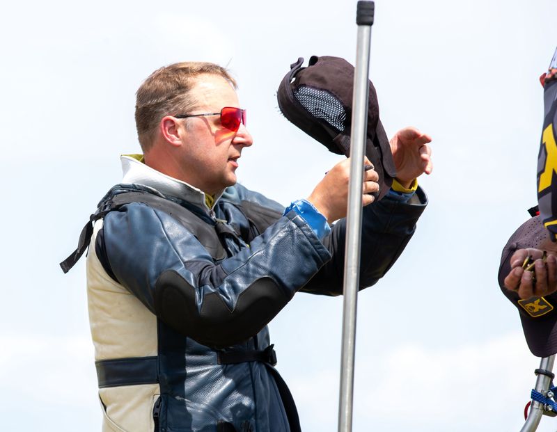 James Fox, 41 of Bend, OR, gathers his gear after shooting in the four-man team match, at Camp Perry on July 24.