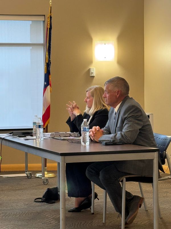 Jerome Township Fire Chief Douglas Stewart and his lawyer Barbara Letcher at a July 27 Jerome Township public hearing on charges against Stewart.