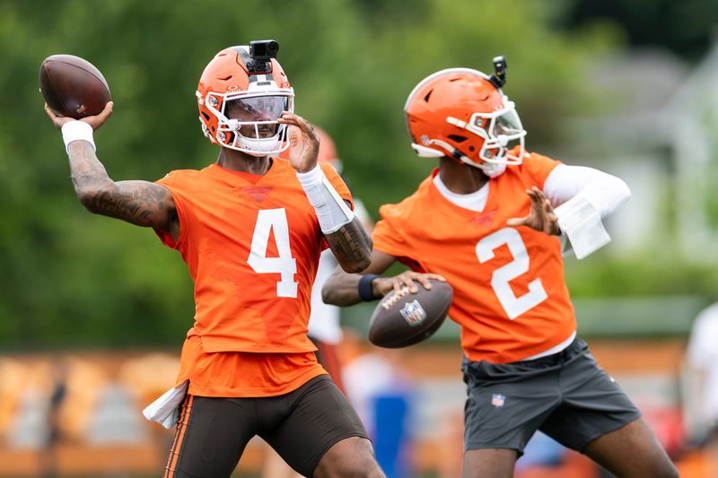 Jun 9, 2026; Berea, OH, USA; Cleveland Browns quarterbacks Deshaun Watson (4) and Shedeur Sanders (2) throw the ball during mandatory mini camp at Cross Country Mortgage Campus. Mandatory Credit: Scott Galvin-Imagn Images