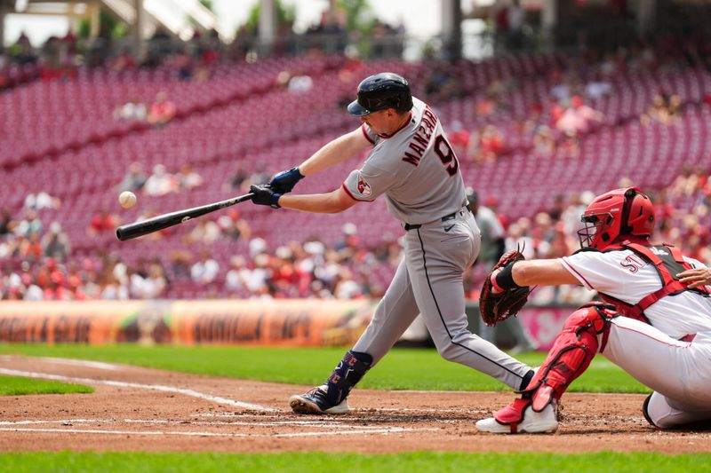 Jul 28, 2026; Cincinnati, Ohio, USA;  Cleveland Guardians first baseman Kyle Manzardo (9) hits a grand slam against the Cincinnati Reds in the first inning at Great American Ball Park. Mandatory Credit: Aaron Doster-Imagn Images