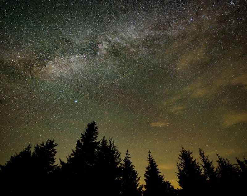In this 30-second exposure, a meteor streaks across the sky during the annual Perseid meteor shower in 2021.