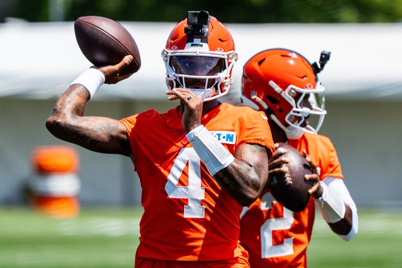 Cleveland Browns quarterback Deshaun Watson (4) and Cleveland Browns quarterback Shedeur Sanders (2) run though drills during the first day of training camp, July 29, 2026, at the Cross Country Mortgage Campus in Berea, Ohio.