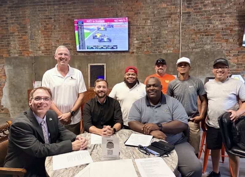Members of Gus Macker Zanesville met with local school leaders on the 2027 tournament site, including Zane State President Joe Keating, left, Kurtus Nichols, Tyler McDade, Dominique Proctor, OUZ Vice Provost Lewatis McNeal, Kenneth Dickinson, Kyle Brookover and Michael Willett.