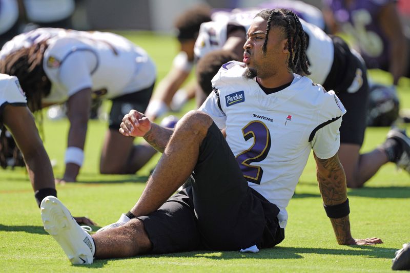 Baltimore Ravens cornerback Nate Wiggins stretches during practice.