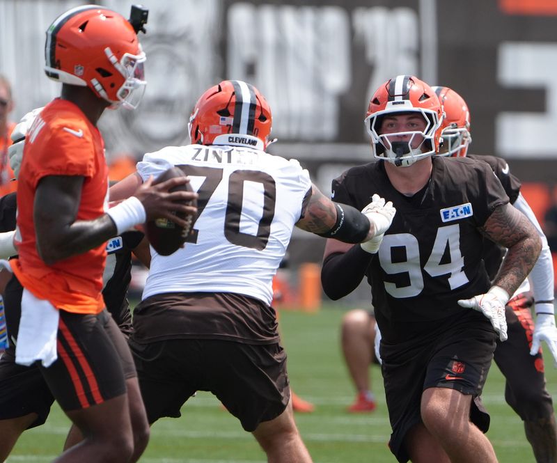 Browns quarterback Deshaun Watson looks to pass as guard Zak Zinter blocks defensive tackle Mason Graham during training camp, July, 31, 2026, in Berea.