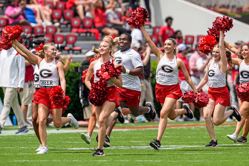 Apr 18, 2026; Athens, GA, USA; Georgia Bulldogs cheerleaders run on the field during the Georgia Spring football game at Sanford Stadium. Mandatory Credit: Dale Zanine-Imagn Images