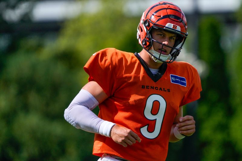Cincinnati Bengals quarterback Joe Burrow runs a play during practice at Paycor Stadium.