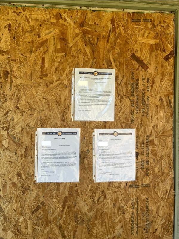 "Unfit for occupancy" letters have been placed on the doors of homes in need of repair on Bonnot Place NE in Canton.