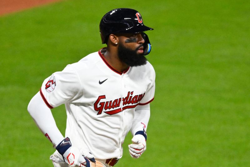 Cleveland Guardians' Jo Adell jogs to first base after walking in the ninth inning against the New York Mets on Aug. 4, 2026, in Cleveland.