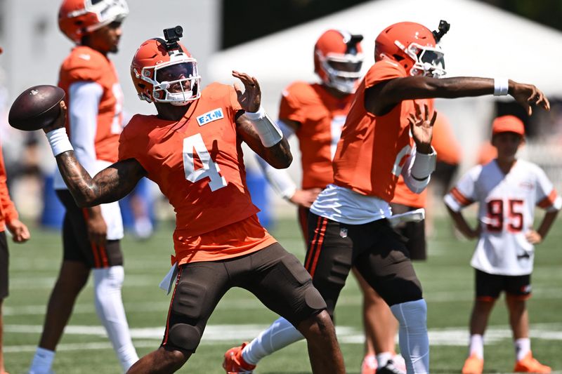 Aug 4, 2026; Berea, OH, USA; Cleveland Browns quarterback Deshaun Watson (4) and quarterback Shedeur Sanders (2) throw passes during training camp at CrossCountry Mortgage Campus. Mandatory Credit: Ken Blaze-Imagn Images