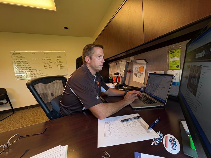 Heath Schools Superintendent Trevor Thomas works inside his office at the school district's office.
