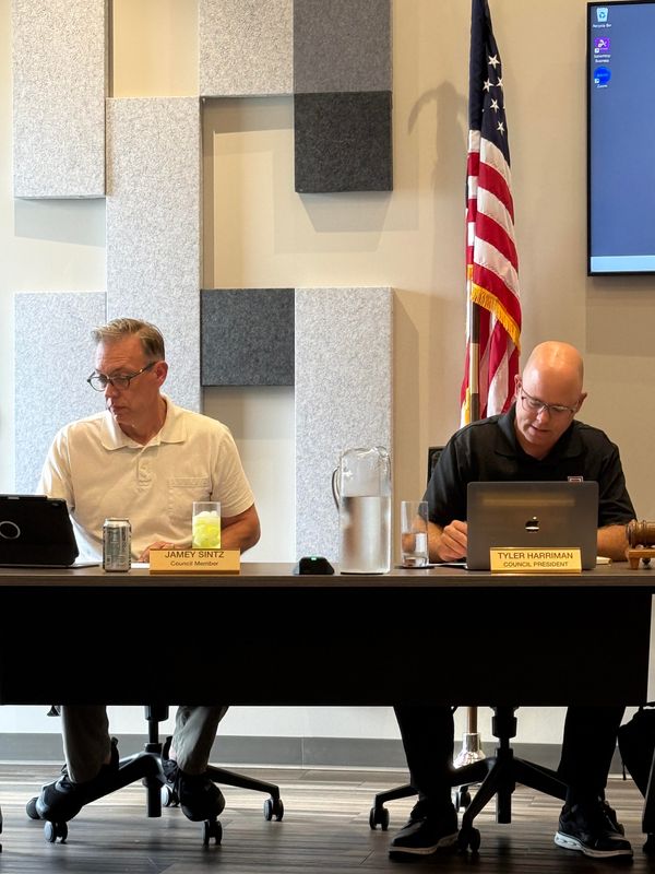 Plain City Village Council member Jamey Sintz and council president Tyler Harriman at an Aug. 5 special meeting.