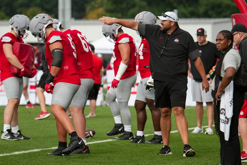 Ohio State Buckeyes offensive line coach Tyler Bowen motions during the first practice of training camp at the Woody Hayes Athletic Center in Columbus on Aug. 6, 2026.