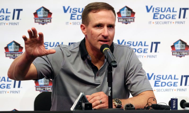 Aug 6, 2026; Canton, Ohio, USA;  2026 Professional Football Hall of Fame enshrinee former New Orleans Saints quarterback Drew Brees speaks at a press conference before the Carolina Panthers and Arizona Cardinals play at Tom Benson Hall of Fame Stadium. Mandatory Credit: Charles LeClaire-Imagn Images