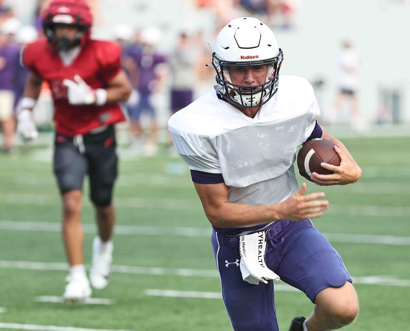 Elder quarterback Kaden Estep scores a touchdown during their scrimmage against Lakota West on Thursday, Aug. 6, 2026.