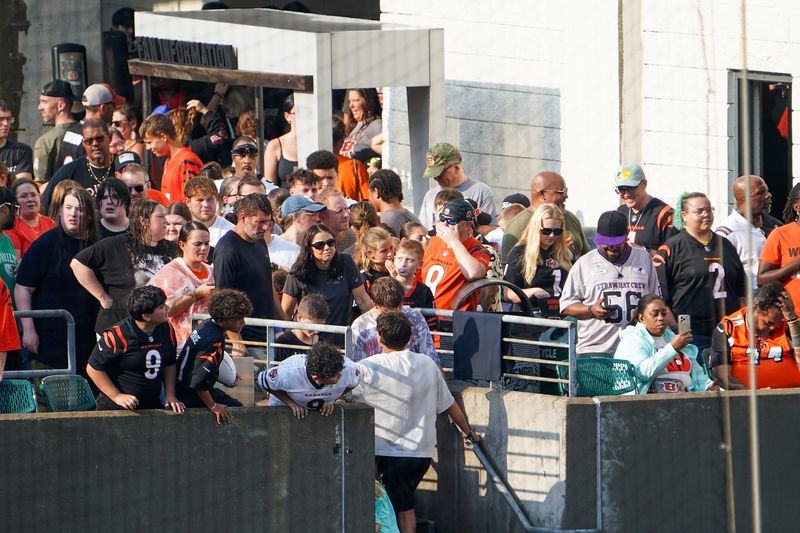 Bengals fans wait on the concourse during a weather delay, Friday, Aug. 7, 2026, at Paycor Stadium in Downtown Cincinnati.