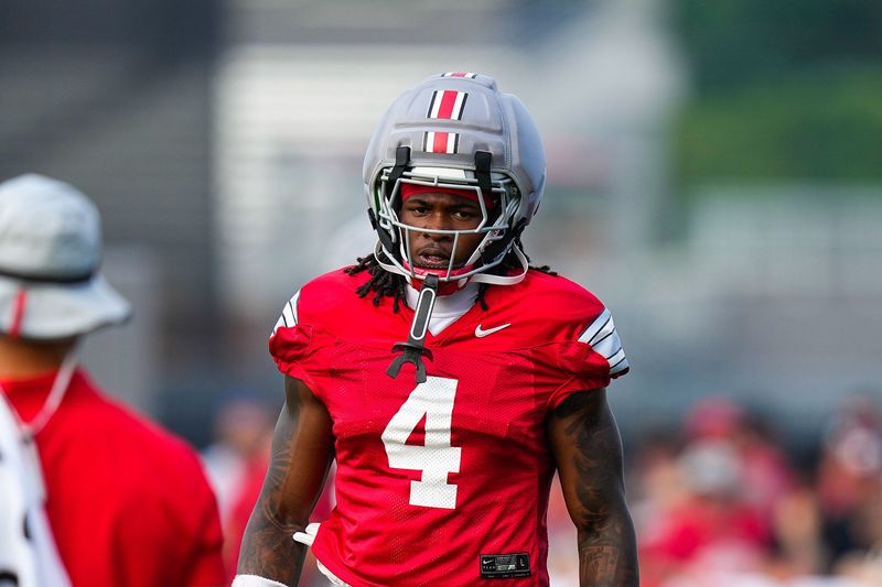 Ohio State Buckeyes wide receiver Jeremiah Smith (4) reacts during the third day of training camp at the Woody Hayes Athletic Center on Aug. 8, 2026 in Columbus, Ohio.