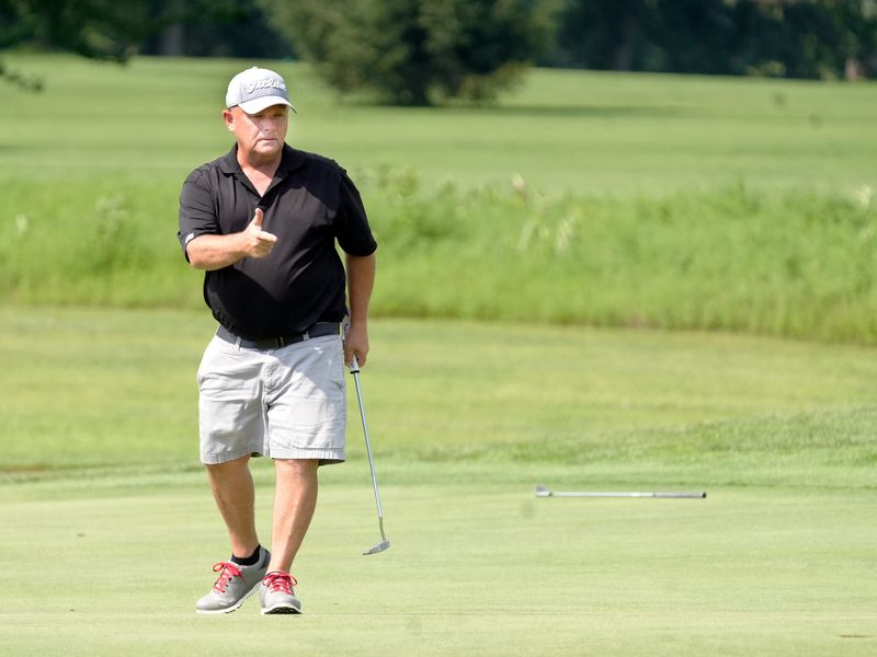 River View grad Brad Baker points to the hole as his birdie putt falls during the second round of the Zanesville District Golf Association Senior Amateur tournament on Saturday, Aug. 8, 2026, at River Greens Golf Course in West Lafayette, Ohio. Baker, six-time Seniors champion, carries a seven-shot lead into the final round.