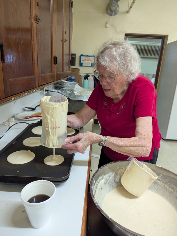 Anna Mae Cummings, 99, makes pancakes for a breakfast giveaway at Grace United Church of Christ in Massillon. Cummings, who will turn 100 on Sept. 5, advises people of all ages to keep busy.
