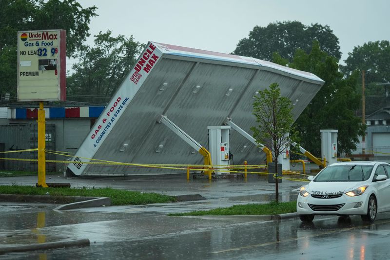 The canopy of the Uncle Max gas station in Linden sits on its side after a severe thunderstorm blew through Columbus on Aug. 11, 2026. Power was out for many residents and many trees were down.