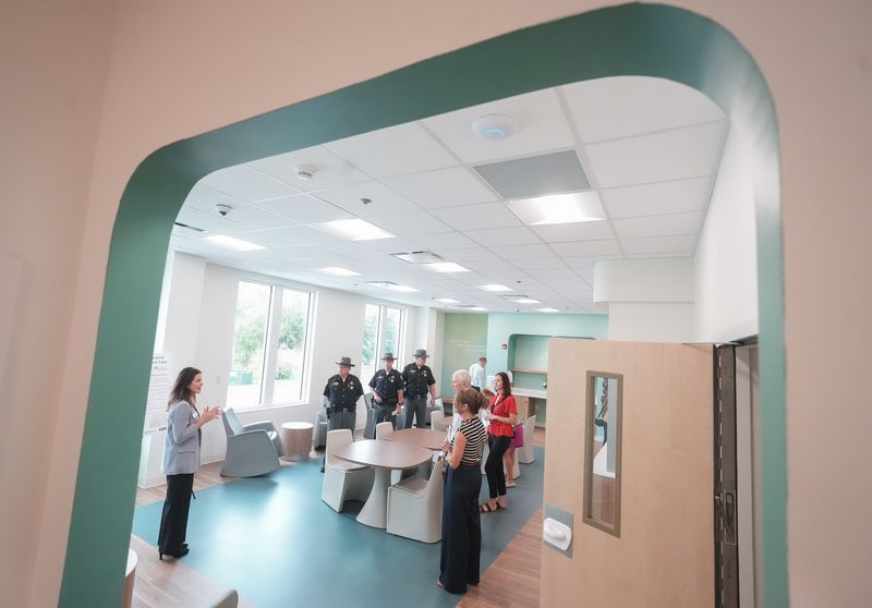 Hilary Futo, chief officer of crisis services in Stark County for Coleman Health Services, far left, leads a tour of the new Stark Behavioral Health Urgent Care facility in Canton during the official grand opening. August 13, 2026