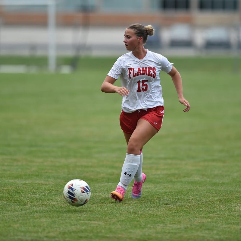 Mansfield Christian's Natalie Ricker looks for an open teammate during the Flames' 8-0 nonconference win over the Mansfield Senior Tygers on Friday, Aug. 14, 2026 at Mehock Field in Mansfield.