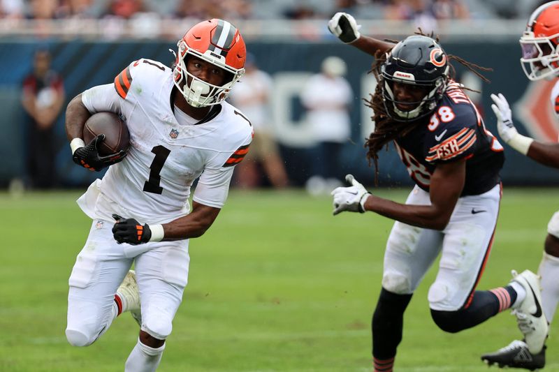 Aug 15, 2026; Chicago, Illinois, USA; Cleveland Browns wide receiver Kc Concepcion (1) makes a catch past Chicago Bears safety Skyler Thomas (38) during the first half at Soldier Field. Mandatory Credit: Mike Dinovo-Imagn Images