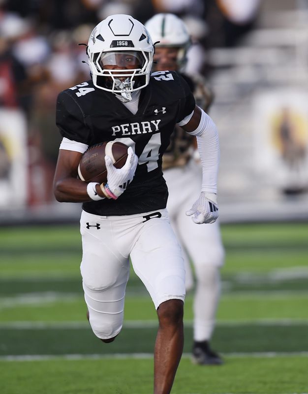 Perry's Jonathan Lemon eyes the end zone for one of his four touchdowns against Central Catholic at Wakefield Stadium, Friday, Aug. 21, 2026.