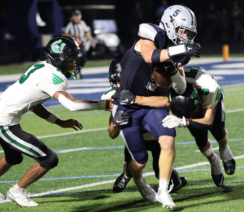 The Clear Fork defense wraps up Granville's Luke Bosse during the visiting Colts' 28-14 victory on Aug. 21, 2026.
