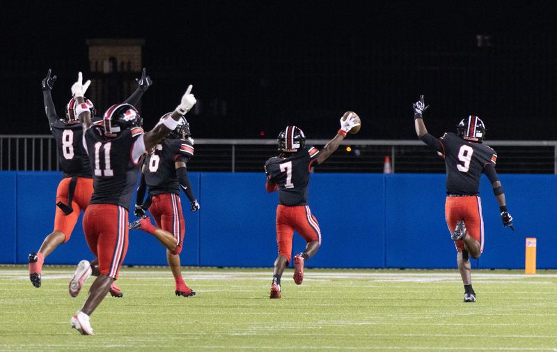 McKinley’s Dwoyne Robinson (7) returns an interception 98 yards for a touchdown against Harding, which was trying to convert a fourth-and-goal from the 4, Friday, Aug. 21, 2026.