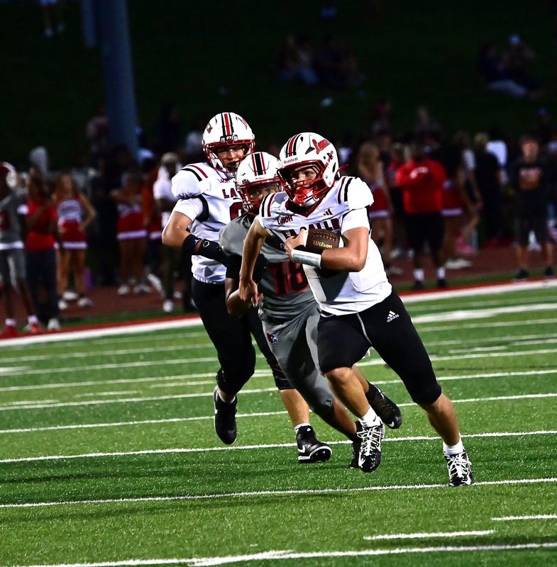 La Salle quarterback Garrett Fraley eyes first-down yards during the OHSAA football game on Friday, Aug. 21, 2026, at Colerain High School.