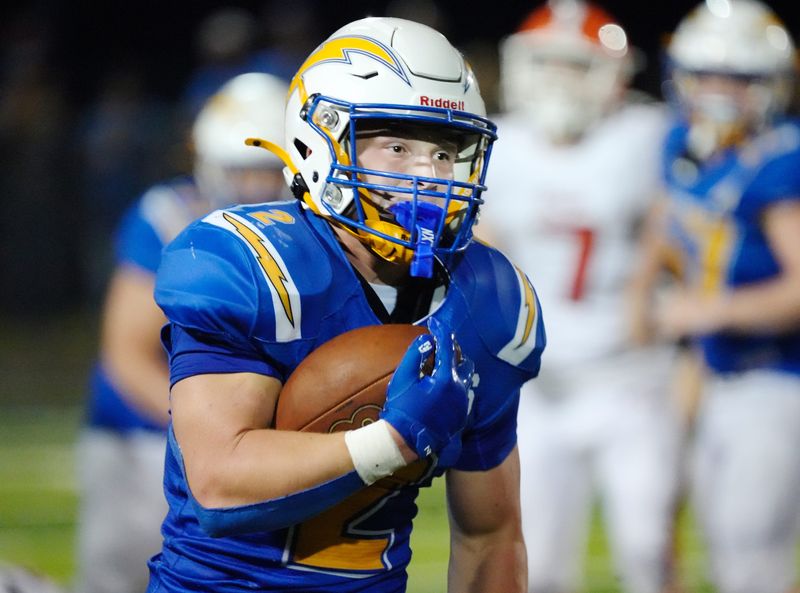 Philo senior Slade Sprankle breaks off a 45-yard run during the third quarter of a 50-21 win against visiting Heath in a high school football game on Friday, Aug. 21, 2026, at Sam Hatfield Stadium in Duncan Falls, Ohio. Sprankle ran 40 times for a school-record 342 yards, breaking the former record set by Carter Paul in 2007.