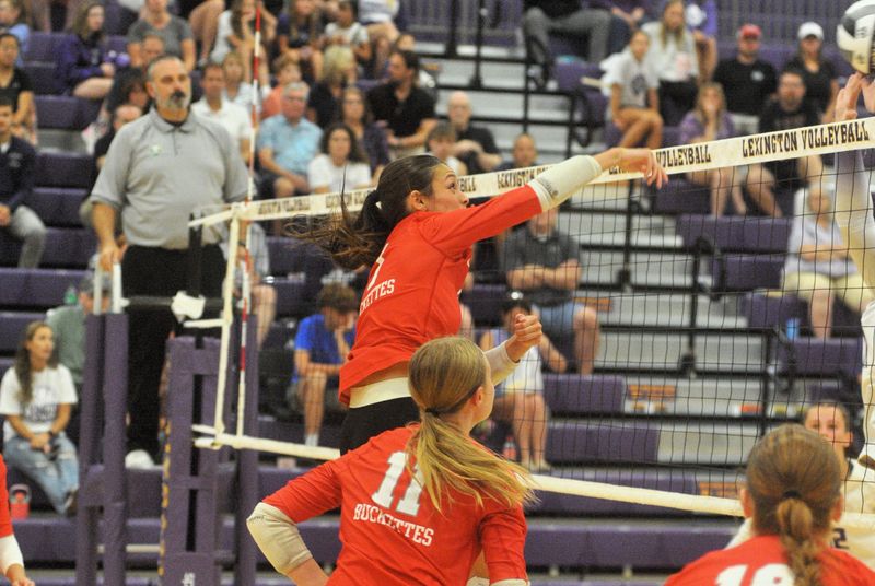 Buckeye Central's Jocelynn Hensley smashes a ball across the net. The Buckettes swept Lady Lex (25-15, 25-14, 25-11) in a nonleague clash at Lexington High School on August 22, 2026.