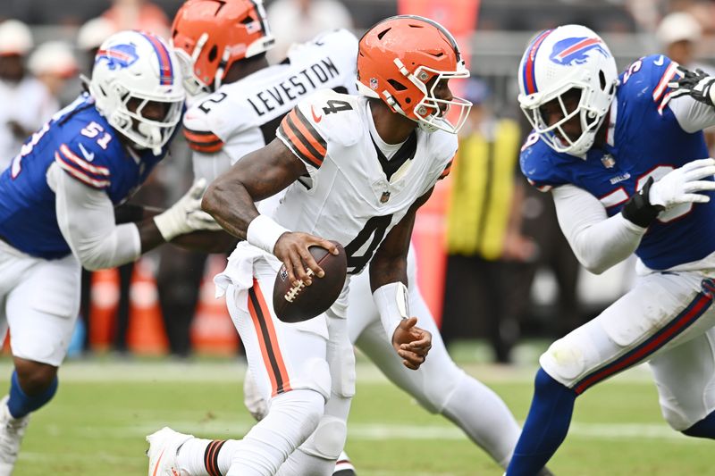 Aug 22, 2026; Cleveland, Ohio, USA; Cleveland Browns quarterback Deshaun Watson (4) scrambles during the second half against the Buffalo Bills at Huntington Bank Field. Mandatory Credit: Ken Blaze-Imagn Images