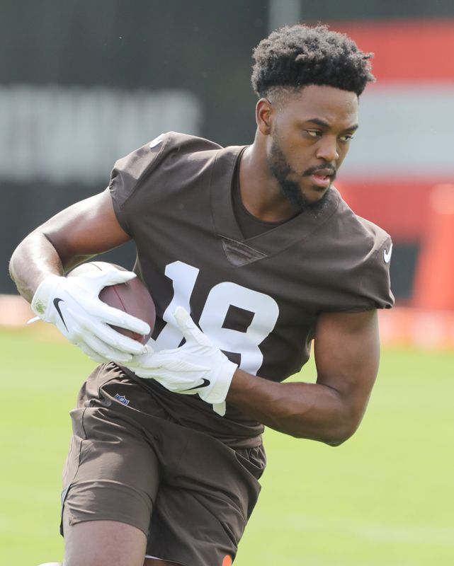 Cleveland Browns rookie receiver David Bell runs after a catch during OTA practice on Wednesday, May 25, 2022 in Berea.