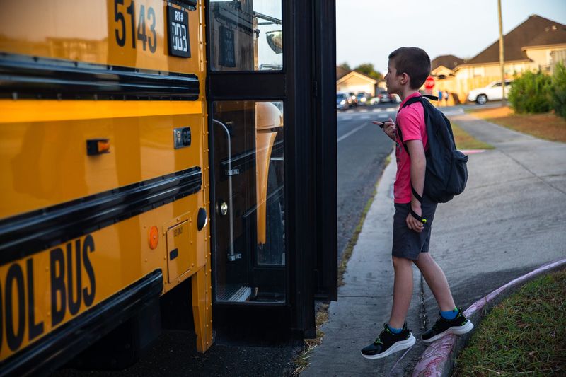 In this 2022 file photo, Joseph Andrews boards a school bus to Windsor Park Elementary School in Corpus Christi.