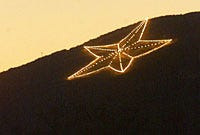 Organizers of the El Paso Star Drop said the 10 x 10 star includes built-in LED lights that will mimic the star on the Franklin Mountains (pictured).