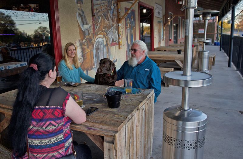 A group of people enjoy the outdoors on the patio of the SoCo Taphouse and Brew Company in downtown San Angelo in this Standard-Times photo from March 20, 2020.