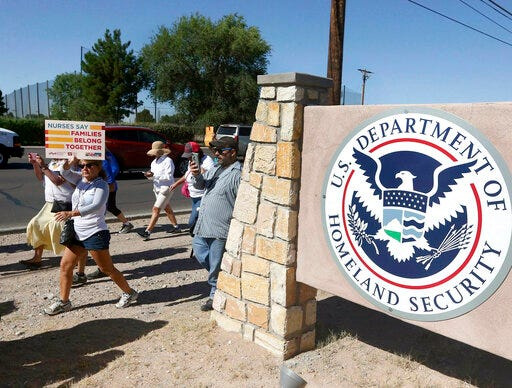 FILE - This June 2018 file photo shows protesters walking along Montana Avenue outside the El Paso Processing Center, in El Paso, Texas. The U.S. government has suddenly stopped force-feeding a group of men on a hunger strike inside a Texas immigration detention center, U.S. Immigration and Customs Enforcement said Thursday, Feb. 14, 2019. The dramatic reversal comes as public pressure was mounting on ICE to halt the practice, which involves feeding detainees through nasal tubes against their will. (Rudy Gutierrez/The El Paso Times via AP, File)