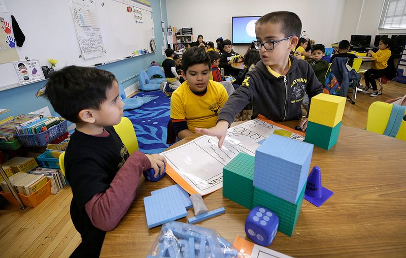 Crockett Elementary students work on a group project in their newly renovated classroom at the 100-year-old Central El Paso school. The school was renovated with EPISD 2016 bond money.