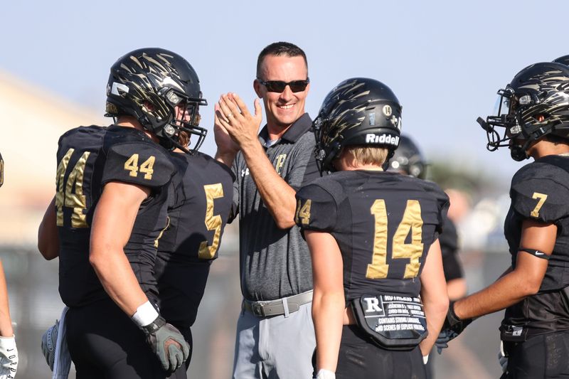Bushland’s Head Coach Josh Reynolds encourages his team before a non-district game against West Plains, Friday night, August 25, 2023, at Falcon Stadium, in Bushland, Texas. Bushland won 47-41.