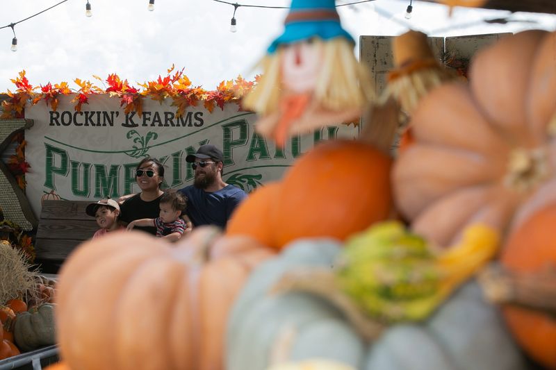 The Butryn family poses for a photo in the Pumpkin Barn at Rockin' K Farms in Robstown on Sept. 30, 2023.